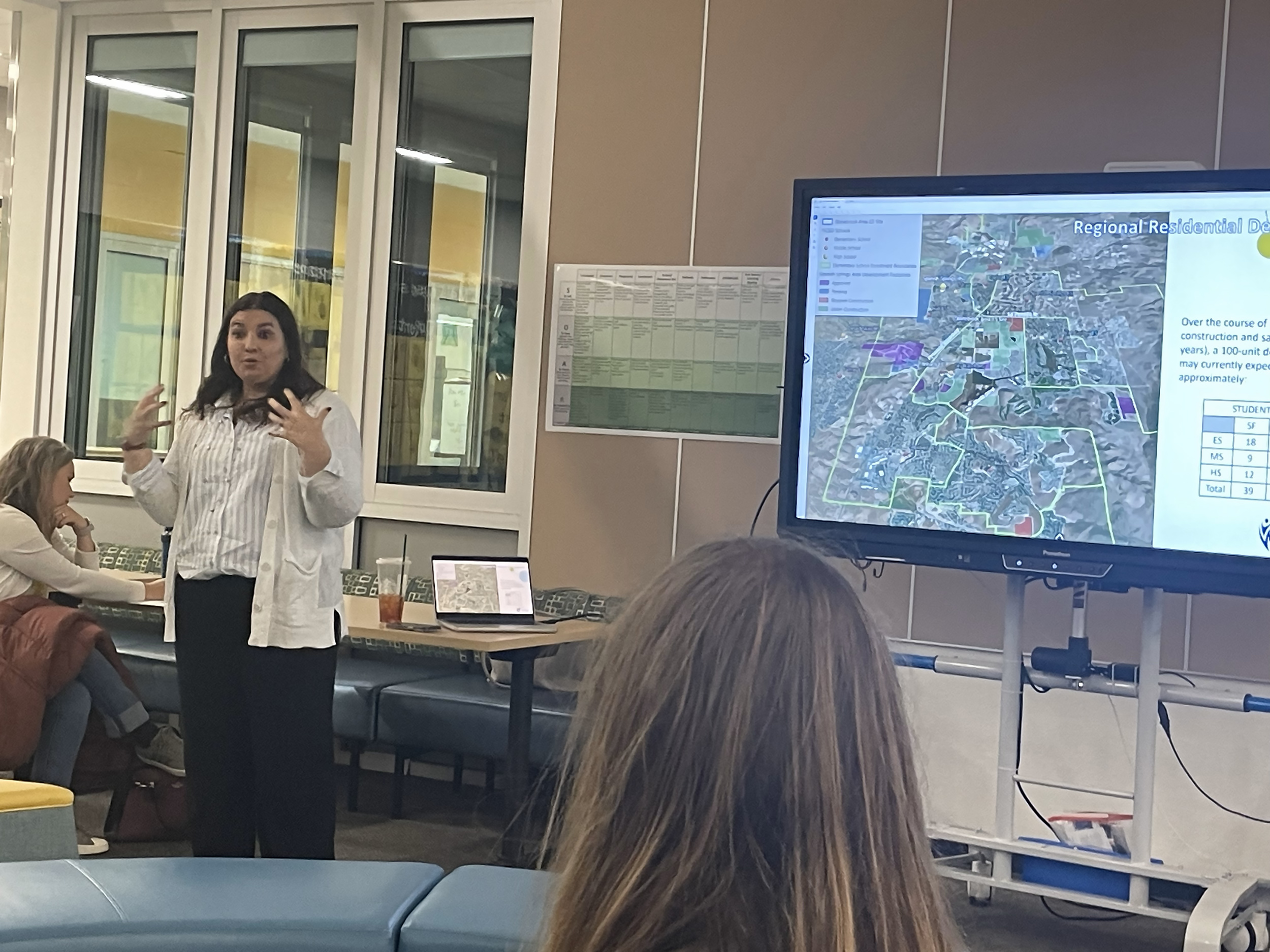 Christine Hull delivering a presentation and answering questions at a Washoe County School Board Zoning Advisory Committee meeting in the community
