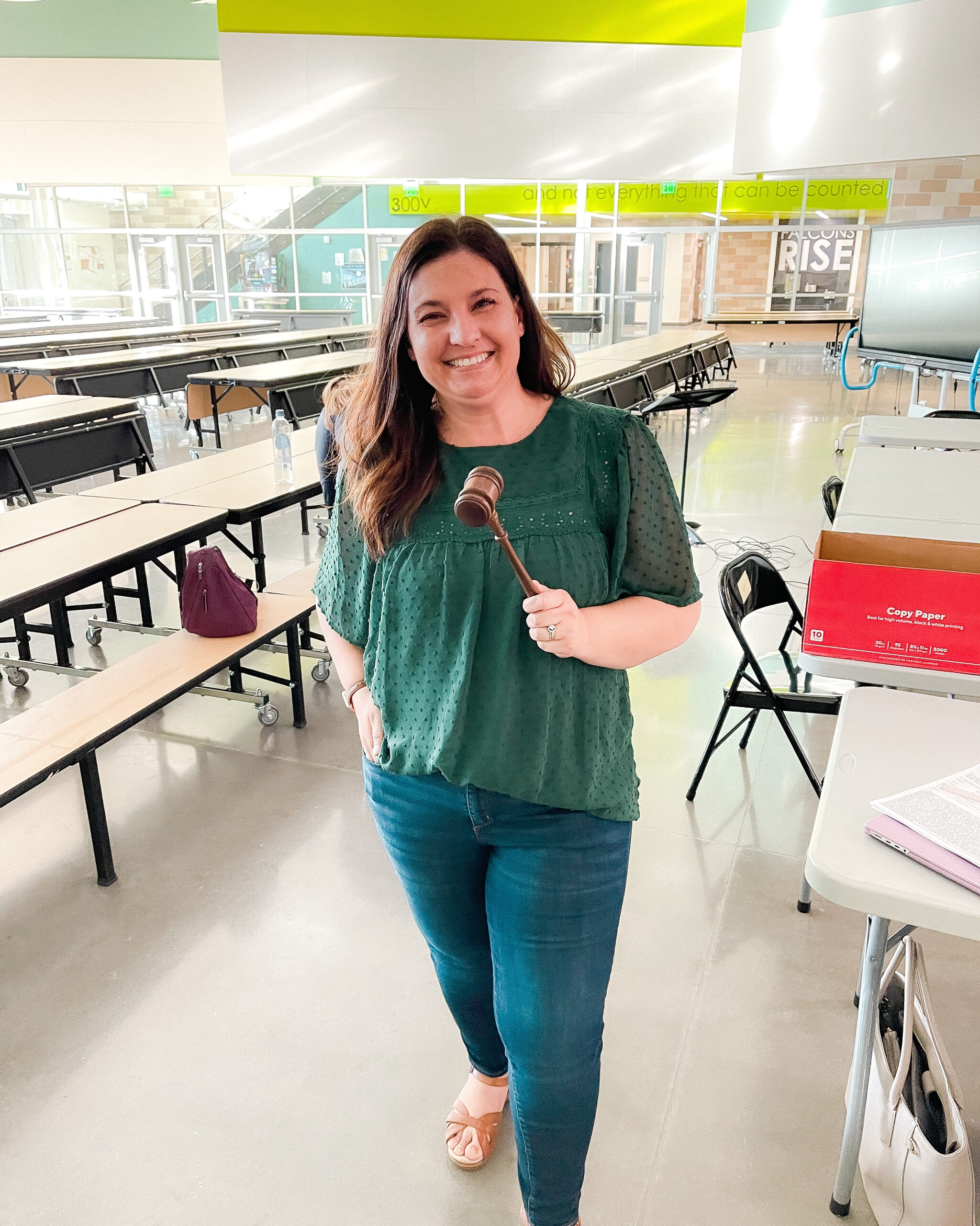 Christine Hull in a classroom with a gavel.